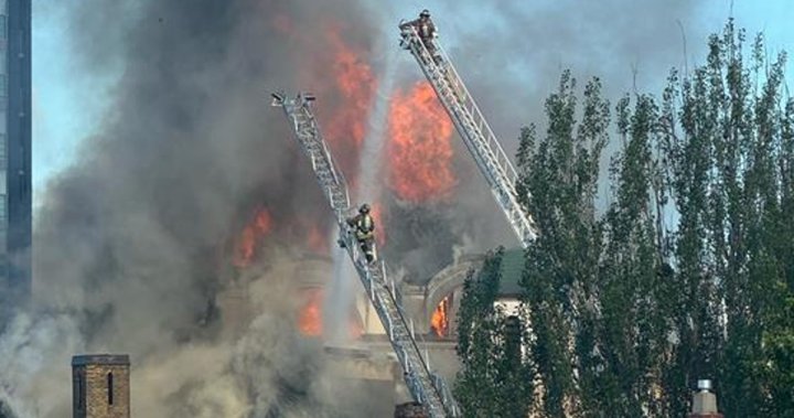 Firefighters battle blaze at historic Toronto church known for Group of Seven murals